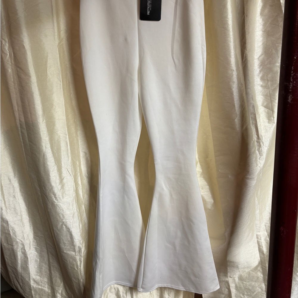 Prettylittlethings.com high waisted white bellbottoms.